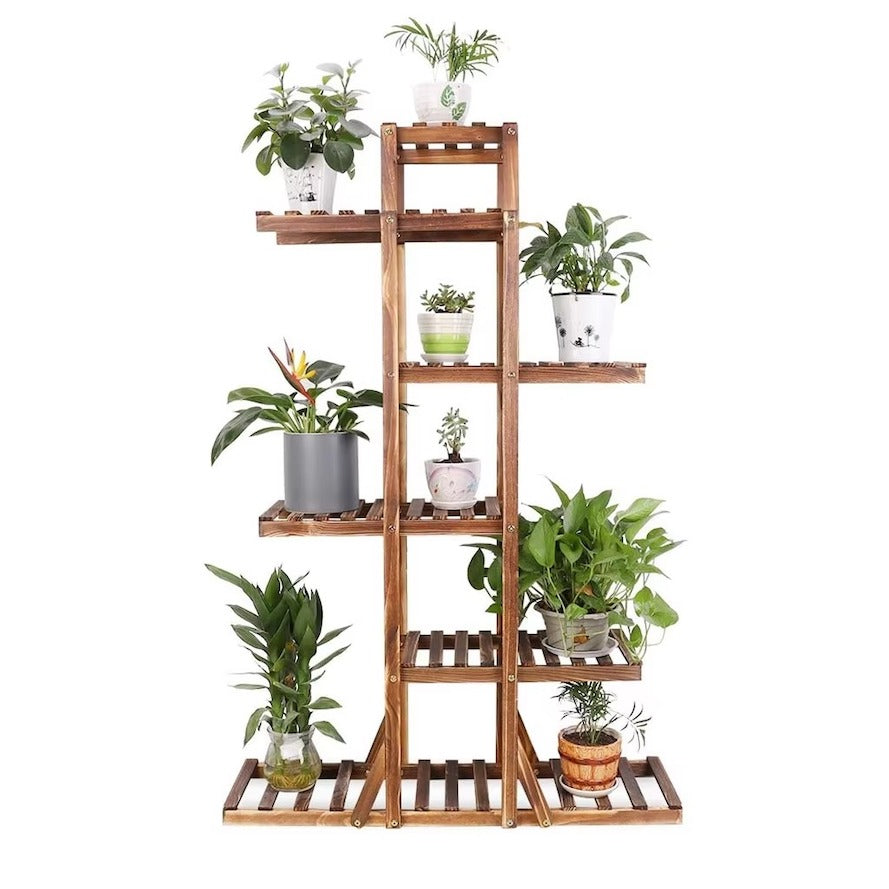 A wooden 6-tier plant stand with a slatted shelf design, shown holding various potted green plants against a solid white background.