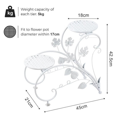 White metal two-tier garden planter stand with decorative leaf and vine motifs, shown with dimension labels (45cm, 21cm, 18cm, 42.5cm) and weight capacity text on a white background.